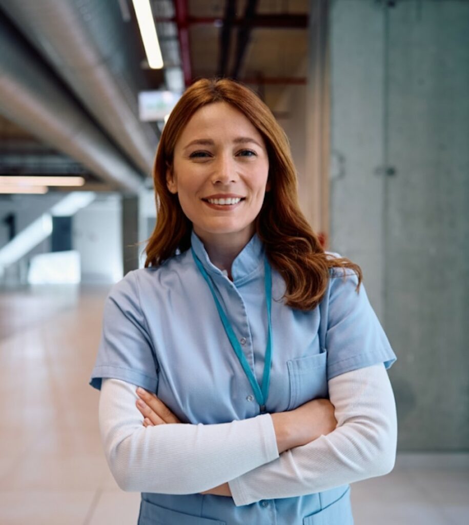Clinical woman worker with crossed hands and smilling