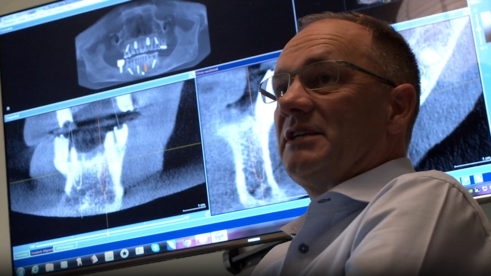 Person talking with a ct scans at the background